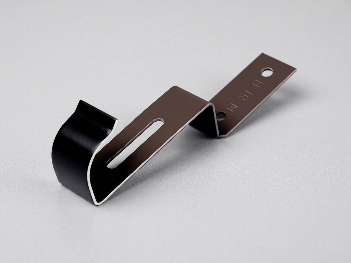 Příchytka hřebenových tašek CLAMP tmavě hnědá FIXING UNI