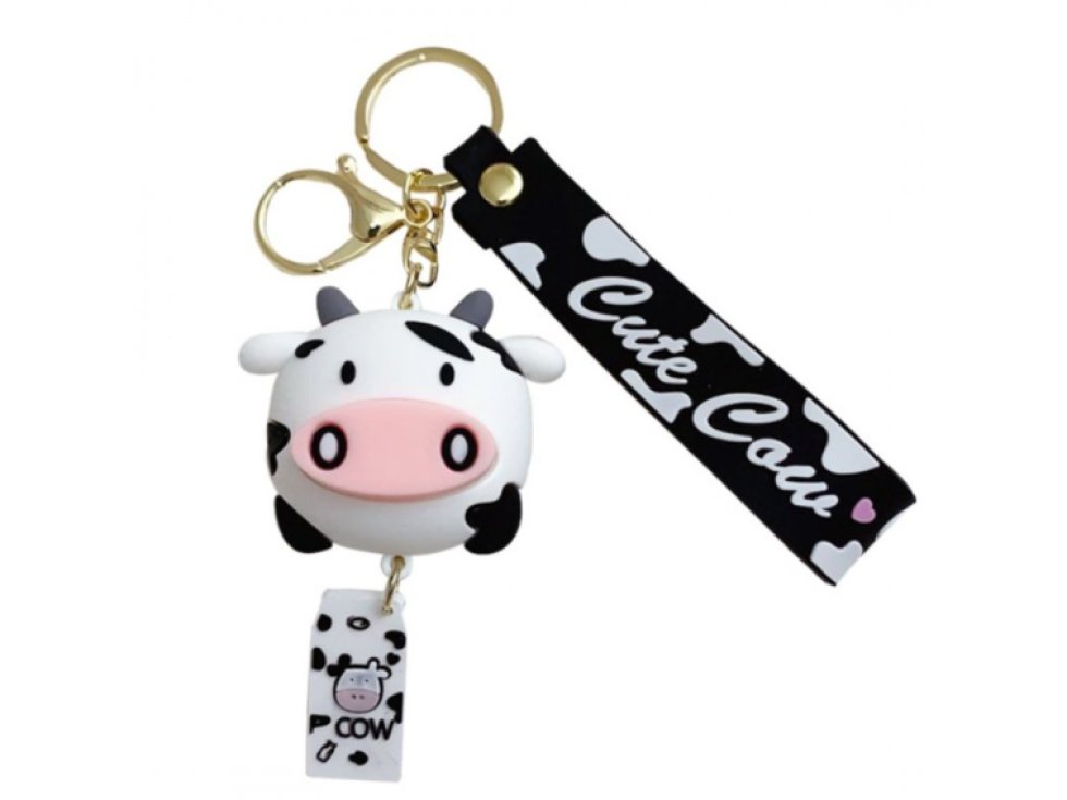 Klíčenka s motivem bílé a černé krávy, rozměry 8,5x5,5 cm, délka s karabinerem 17 cm